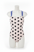 Girls white and black polka dot open-back one-piece swimsuit front view